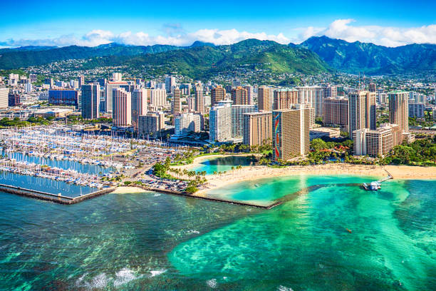 istockphoto-937463818-612×612 Downtown Honolulu on Oahu, Hawaii shot from an altitude of about 1000 feet over the Pacific Ocean.
